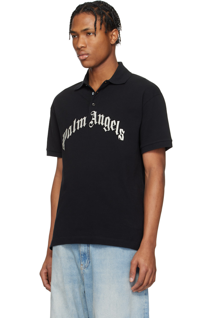Cotton piqué polo.

· Rib-knit spread collar and cuffs
· Three-button placket
· Embroidered logo at front
· Logo flag at side seam
· Tennis-tail hem
· Dropped shoulders

Supplier color: Black