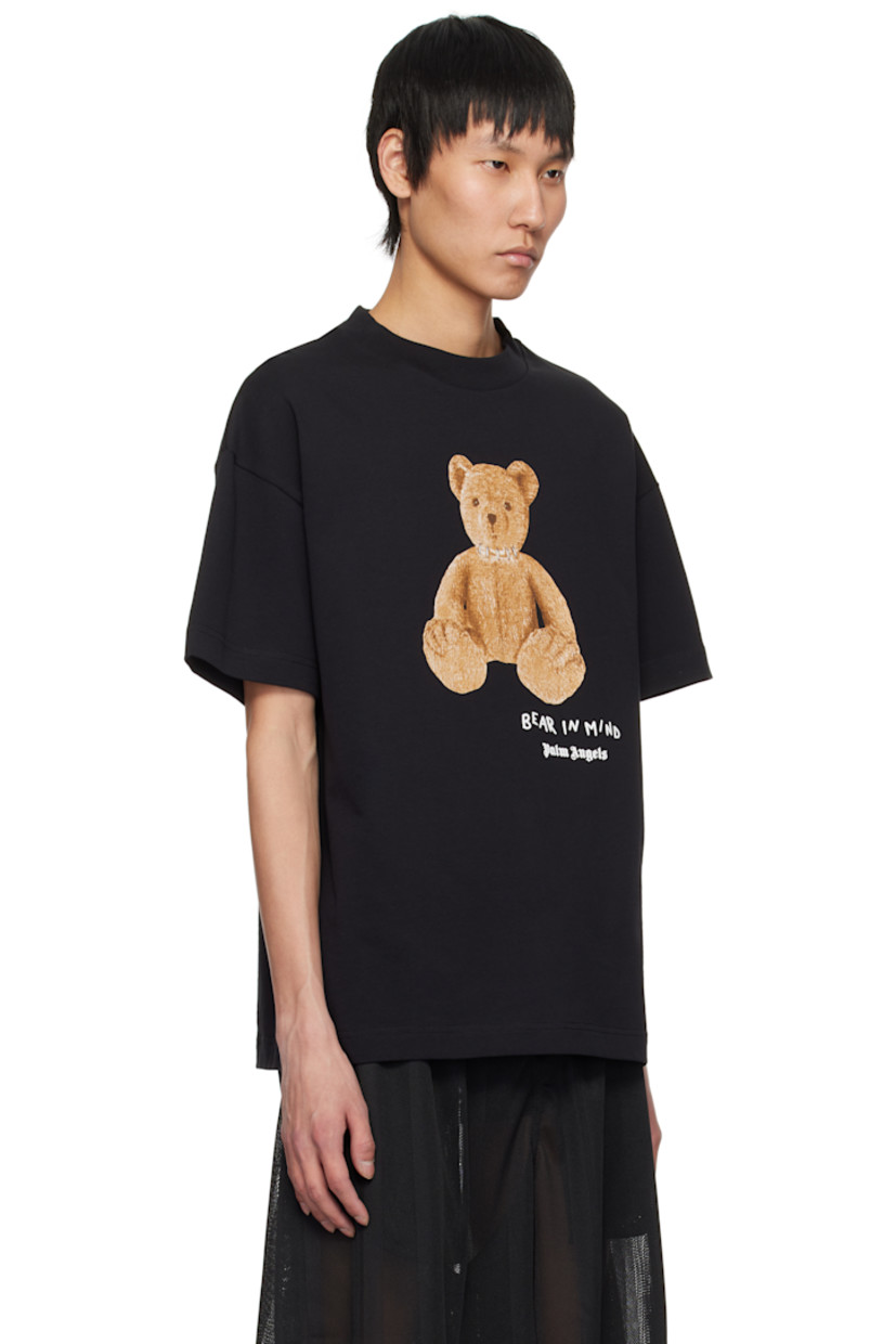 Cotton jersey T-shirt. 

· Rib-knit crewneck
· Logo, graphic, and text bonded at front 
· Logo flag at side seam
· Dropped shoulders

Supplier color: Black/Brown