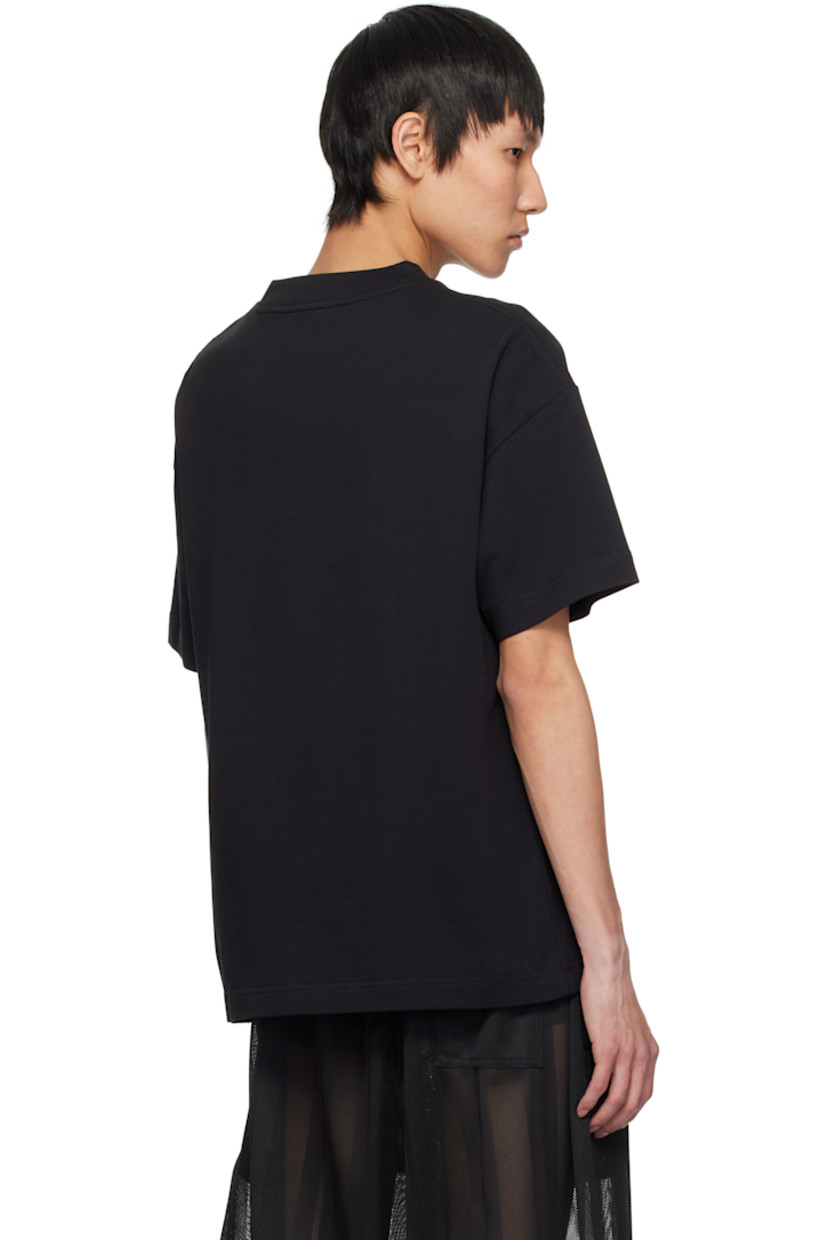 Cotton jersey T-shirt. 

· Rib-knit crewneck
· Logo, graphic, and text bonded at front 
· Logo flag at side seam
· Dropped shoulders

Supplier color: Black/Brown
