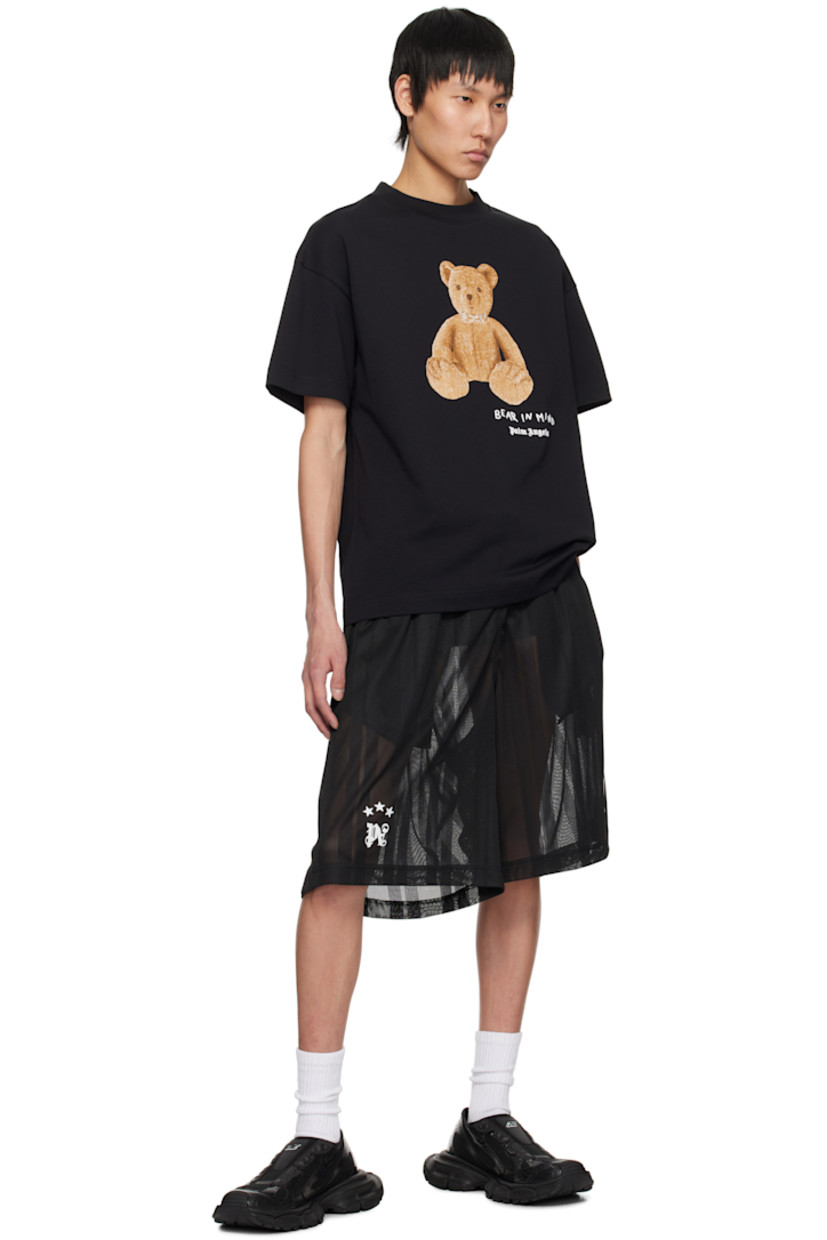 Cotton jersey T-shirt. 

· Rib-knit crewneck
· Logo, graphic, and text bonded at front 
· Logo flag at side seam
· Dropped shoulders

Supplier color: Black/Brown