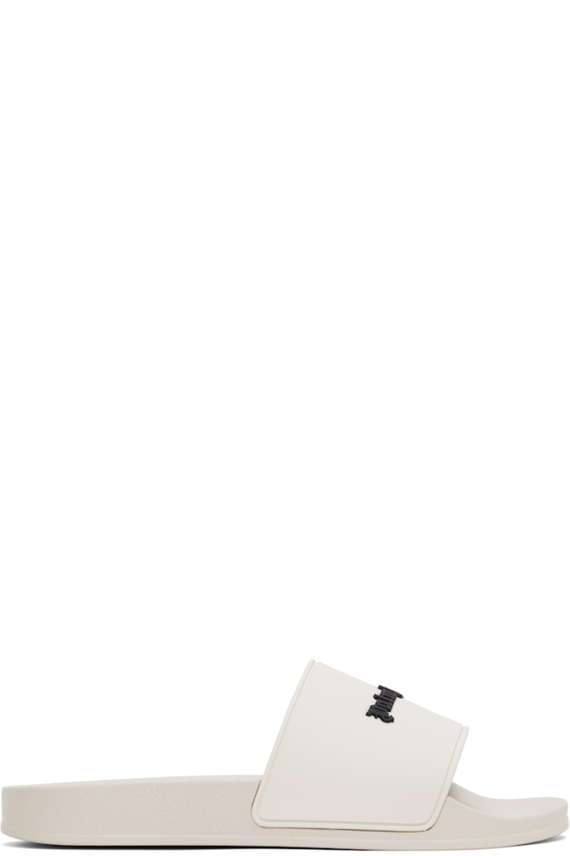 Rubber pool slides in beige.

· Open toe
· Logo embossed at vamp
· Logo embossed at molded footbed
· Treaded rubber sole

Supplier color: Beige/Black