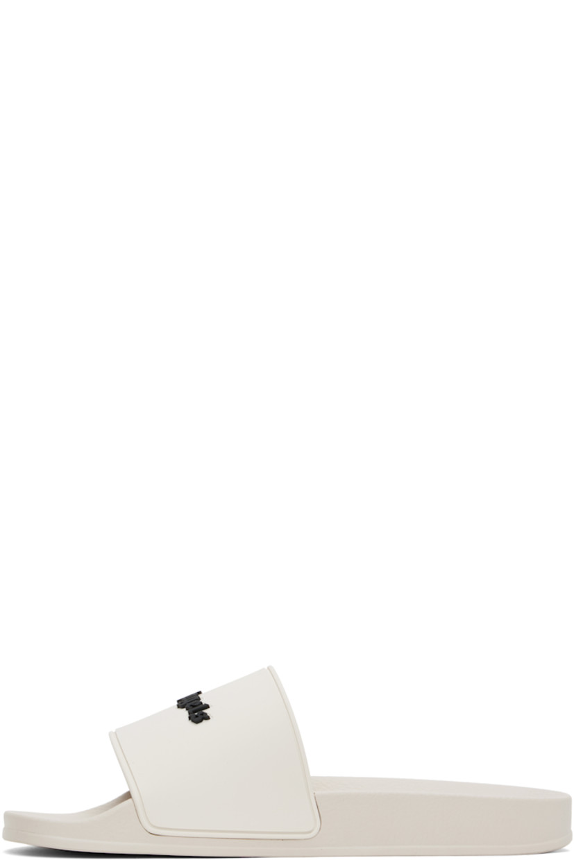 Rubber pool slides in beige.

· Open toe
· Logo embossed at vamp
· Logo embossed at molded footbed
· Treaded rubber sole

Supplier color: Beige/Black