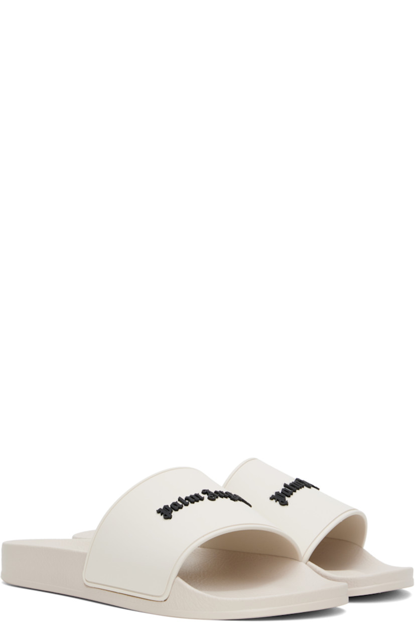 Rubber pool slides in beige.

· Open toe
· Logo embossed at vamp
· Logo embossed at molded footbed
· Treaded rubber sole

Supplier color: Beige/Black