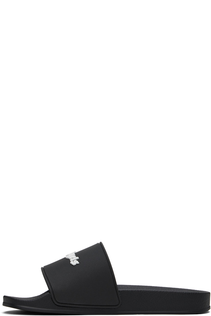Rubber pool slides in black.

· Open toe
· Logo embossed at vamp
· Logo embossed at molded footbed
· Treaded rubber sole

Supplier color: Black/White