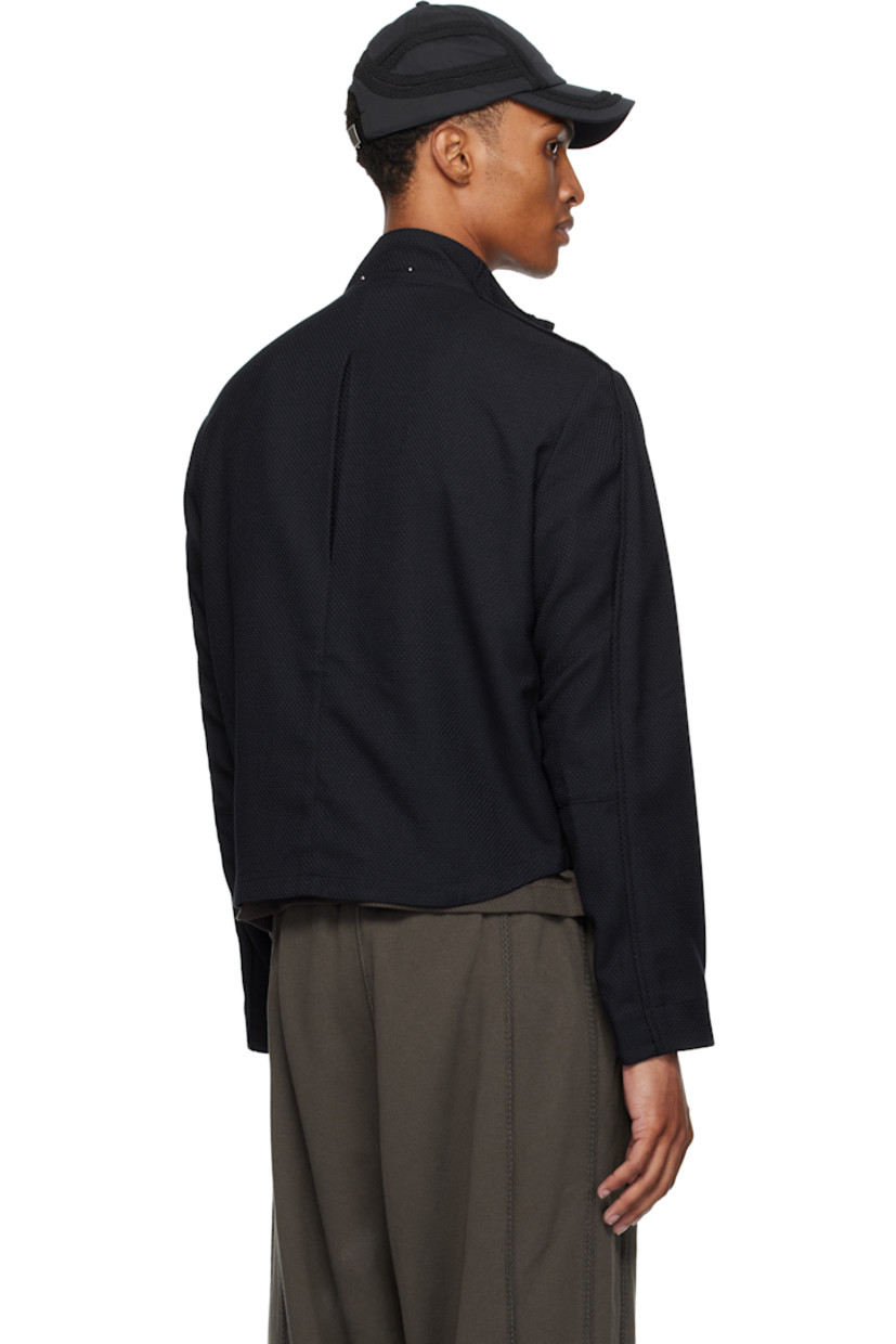 Stretch waffle-woven jacket. 

· Paneled construction
· Stand collar with bead hardware
· Zip closure
· Welt pockets and flap pockets at waist
· Inverted box pleat at back
· Unlined
· Silver-tone hardware

Supplier color: Lapis blue