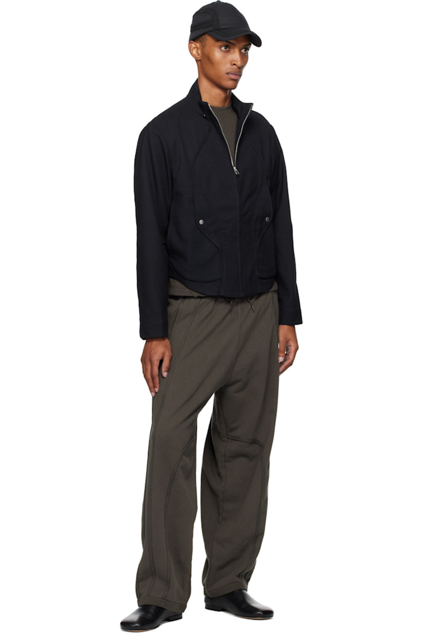 Stretch waffle-woven jacket. 

· Paneled construction
· Stand collar with bead hardware
· Zip closure
· Welt pockets and flap pockets at waist
· Inverted box pleat at back
· Unlined
· Silver-tone hardware

Supplier color: Lapis blue