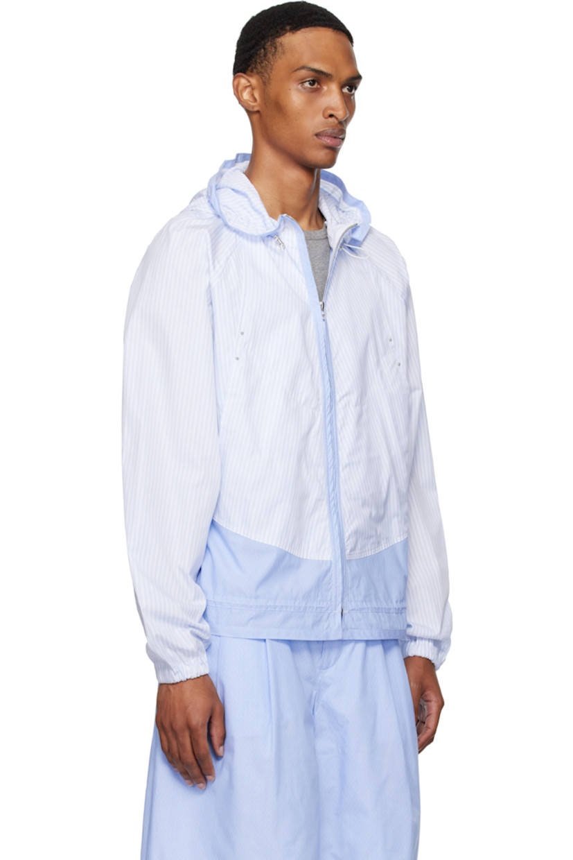 Cotton poplin jacket.

· Striped pattern throughout
· Paneled construction
· Bungee-style drawstring at hood
· Zip closure
· Bead hardware at front
· Welt pockets at waist
· Bungee-style drawstring at waist and hem
· Raglan sleeves
· Elasticized cuffs
· Silver-tone hardware

Supplier color: Azure stripe