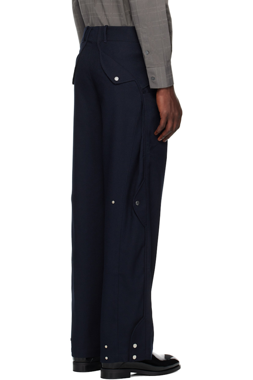 Stretch waffle-woven trousers.

· Paneled construction
· Two-pocket styling
· Belt loops
· Zip fly
· Buttoned pockets at back
· Pleating at back
· Silver-tone hardware

Supplier color: Lapis Blue