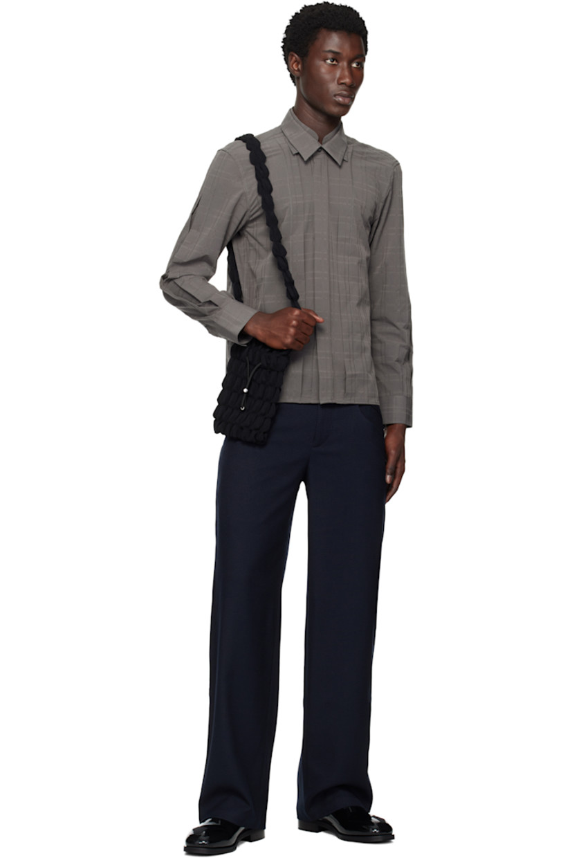 Stretch waffle-woven trousers.

· Paneled construction
· Two-pocket styling
· Belt loops
· Zip fly
· Buttoned pockets at back
· Pleating at back
· Silver-tone hardware

Supplier color: Lapis Blue