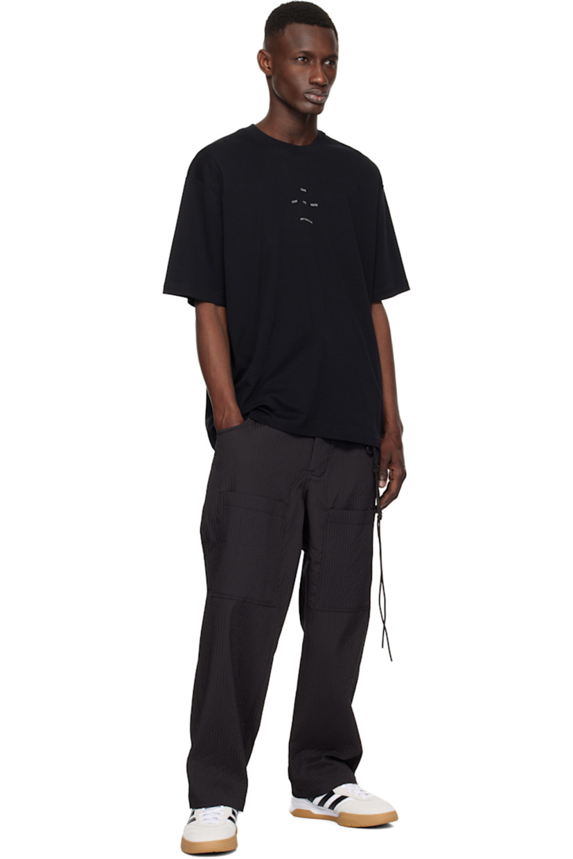 Cotton jersey T-shirt.

· Rib-knit crewneck
· Logo printed at chest
· Dropped shoulders
· Graphic printed at back

Supplier color: Black
