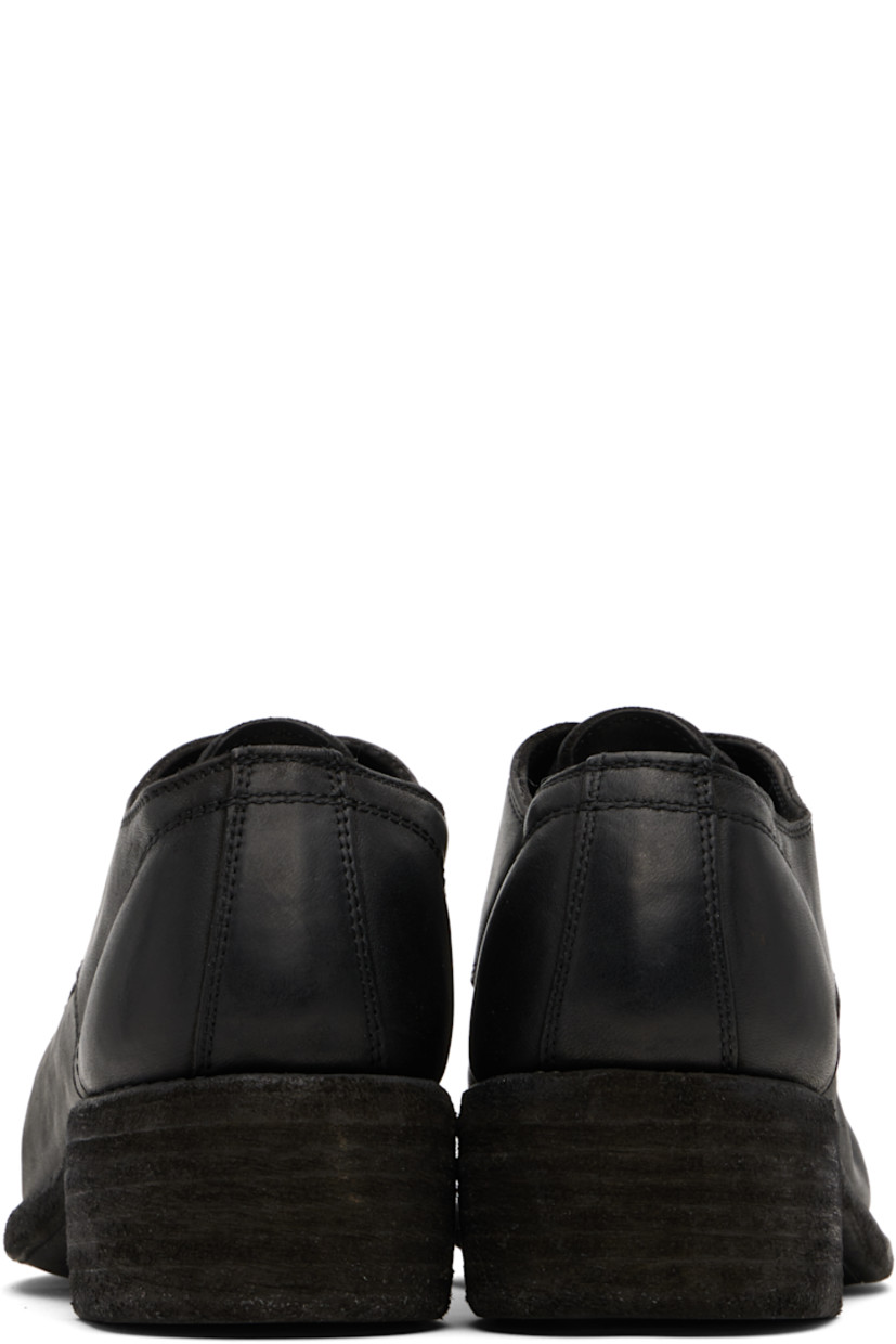 Piece-dyed grained kangaroo leather derbys. 

· Lace-up closure
· Grained leather lining
· Topstitching at Goodyear welt 
· Stacked leather heel
· Leather sole
· Heel: H1.75"

Supplier color: Black