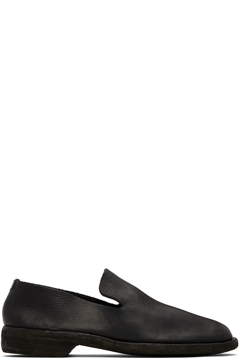 Piece-dyed grained calfskin loafers. 

· Logo embossed at footbed
· Topstitching at Goodyear welt
· Stacked leather heel
· Leather sole

Supplier color: Black