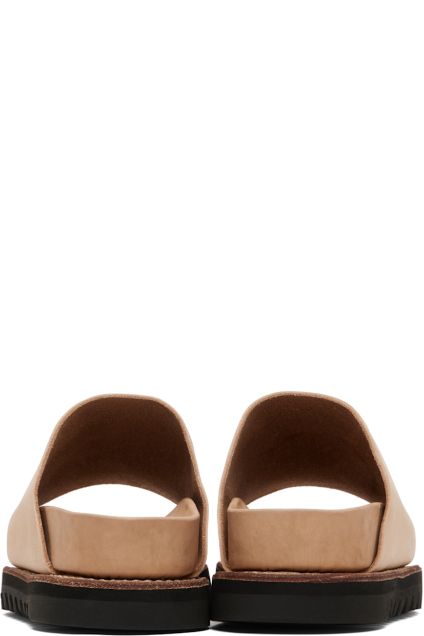 Piece-dyed grained calfskin slip-on sandals.

· Open toe
· Logo embossed at molded leather footbed 
· Goodyear welt
· Vibram® Gumlite® treaded rubber sole

Supplier color: Sand