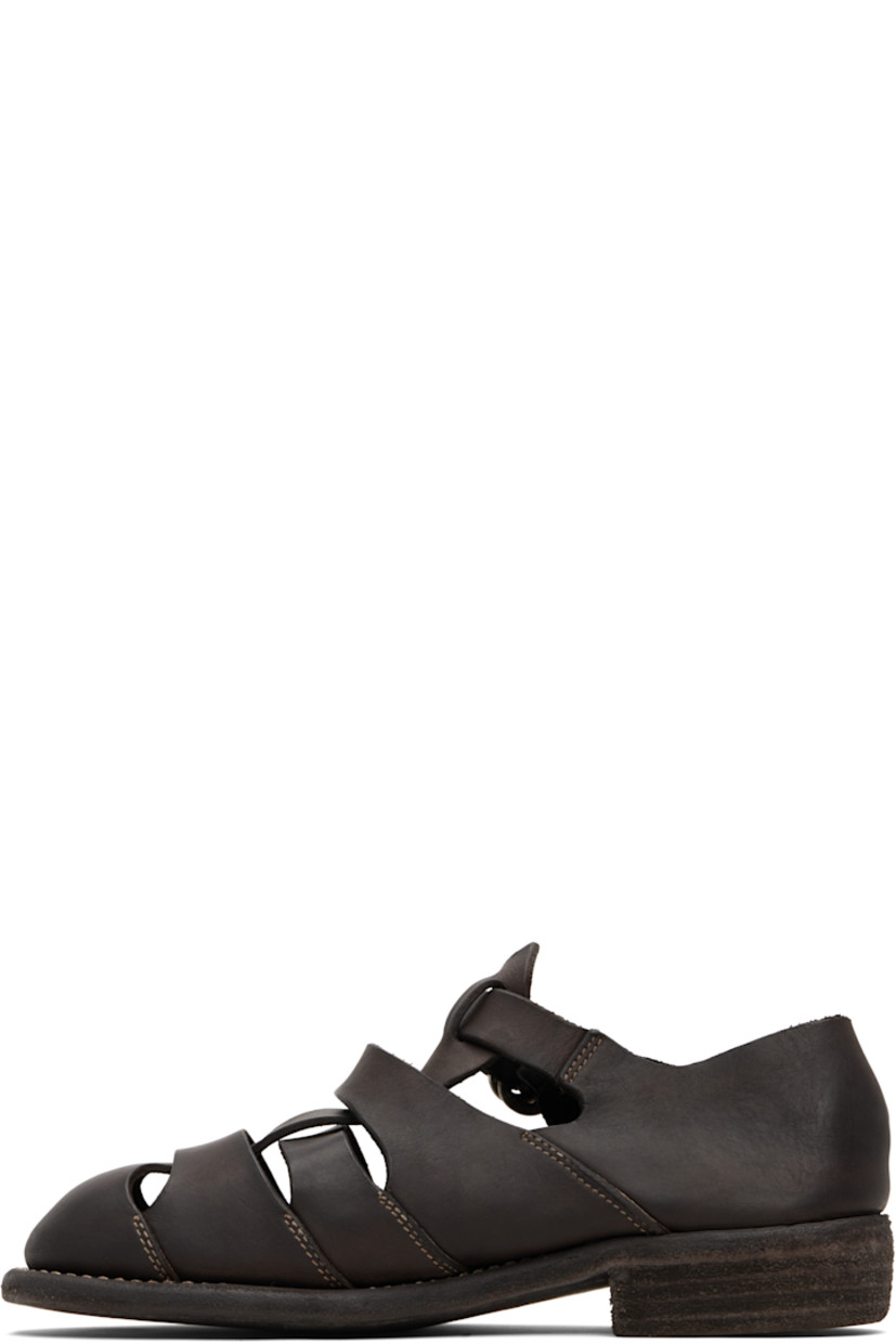 Grained leather flat sandals. 

· Cutouts throughout
· Pin-buckle ankle strap
· Logo embossed at footbed
· Topstitching at welt
· Stacked leather heel 
· Leather sole

Supplier color: Dark brown