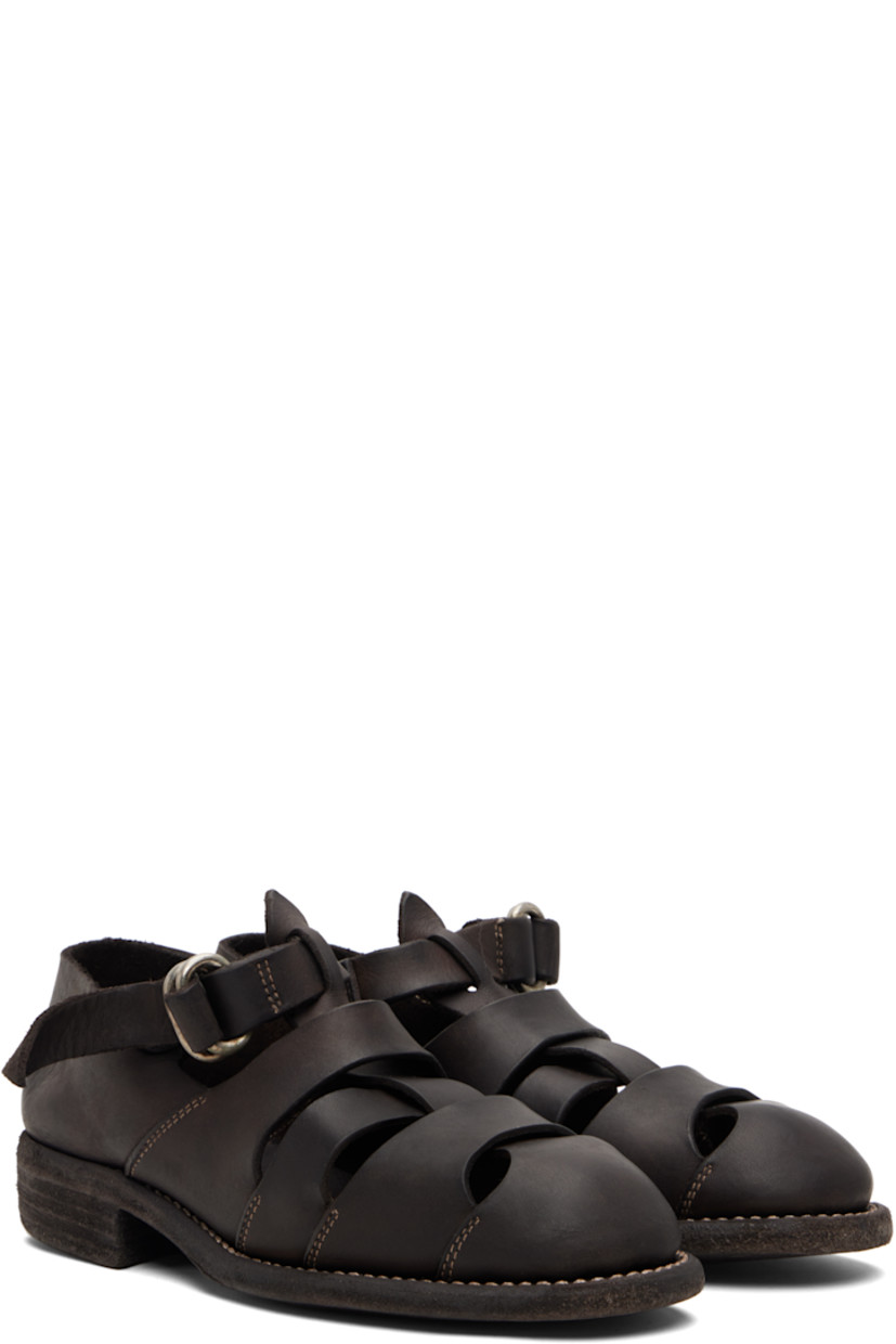 Grained leather flat sandals. 

· Cutouts throughout
· Pin-buckle ankle strap
· Logo embossed at footbed
· Topstitching at welt
· Stacked leather heel 
· Leather sole

Supplier color: Dark brown