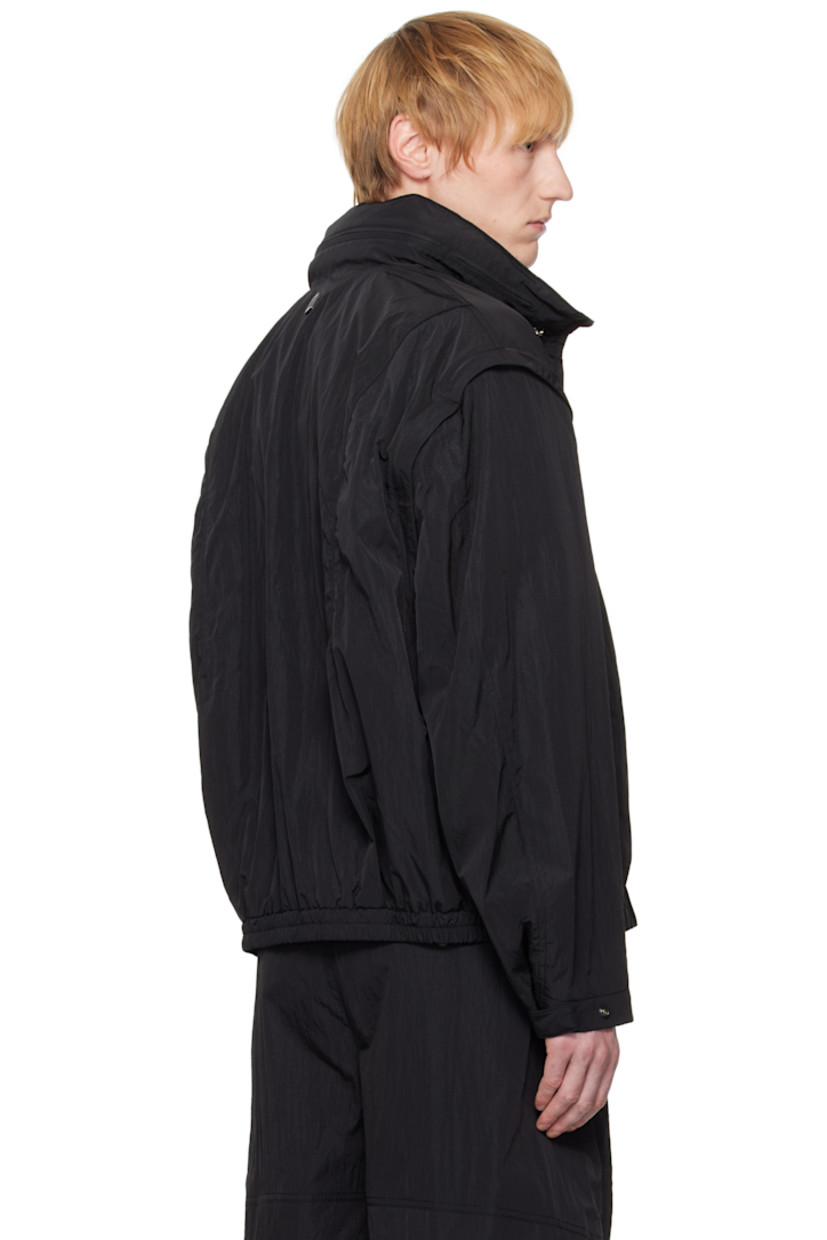 Crinkled nylon taffeta track jacket. 

· Logo and text embroidered at stowaway hood
· Bungee-style drawstring at hood
· Two-way zip closure
· Logo embroidered at front
· Welt pockets
· Elasticized hem 
· Detachable zip sleeves for vest styling
· Adjustable press-stud tab at cuffs
· Logo hardware at back collar
· Full mesh lining

Supplier color: Black