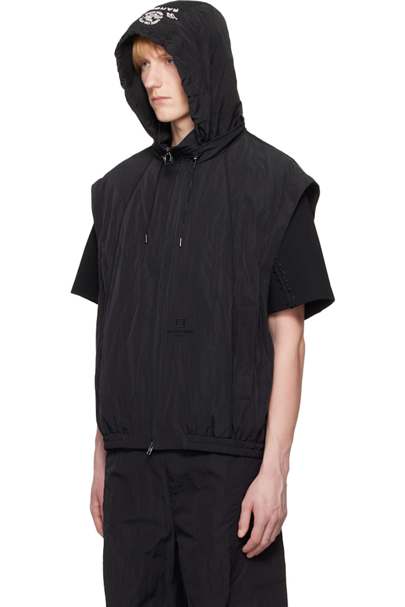 Crinkled nylon taffeta track jacket. 

· Logo and text embroidered at stowaway hood
· Bungee-style drawstring at hood
· Two-way zip closure
· Logo embroidered at front
· Welt pockets
· Elasticized hem 
· Detachable zip sleeves for vest styling
· Adjustable press-stud tab at cuffs
· Logo hardware at back collar
· Full mesh lining

Supplier color: Black