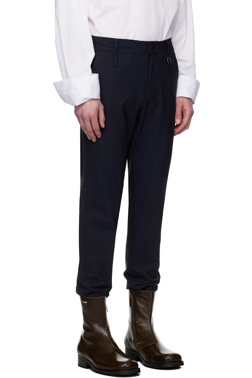 Plain-woven stretch wool-blend trousers.

· Belt loops 
· Concealed drawstring at partially elasticized waistband
· Four-pocket styling
· Zip fly
· Logo hardware at belt loop
· Rib-knit cuffs

Supplier color: Navy