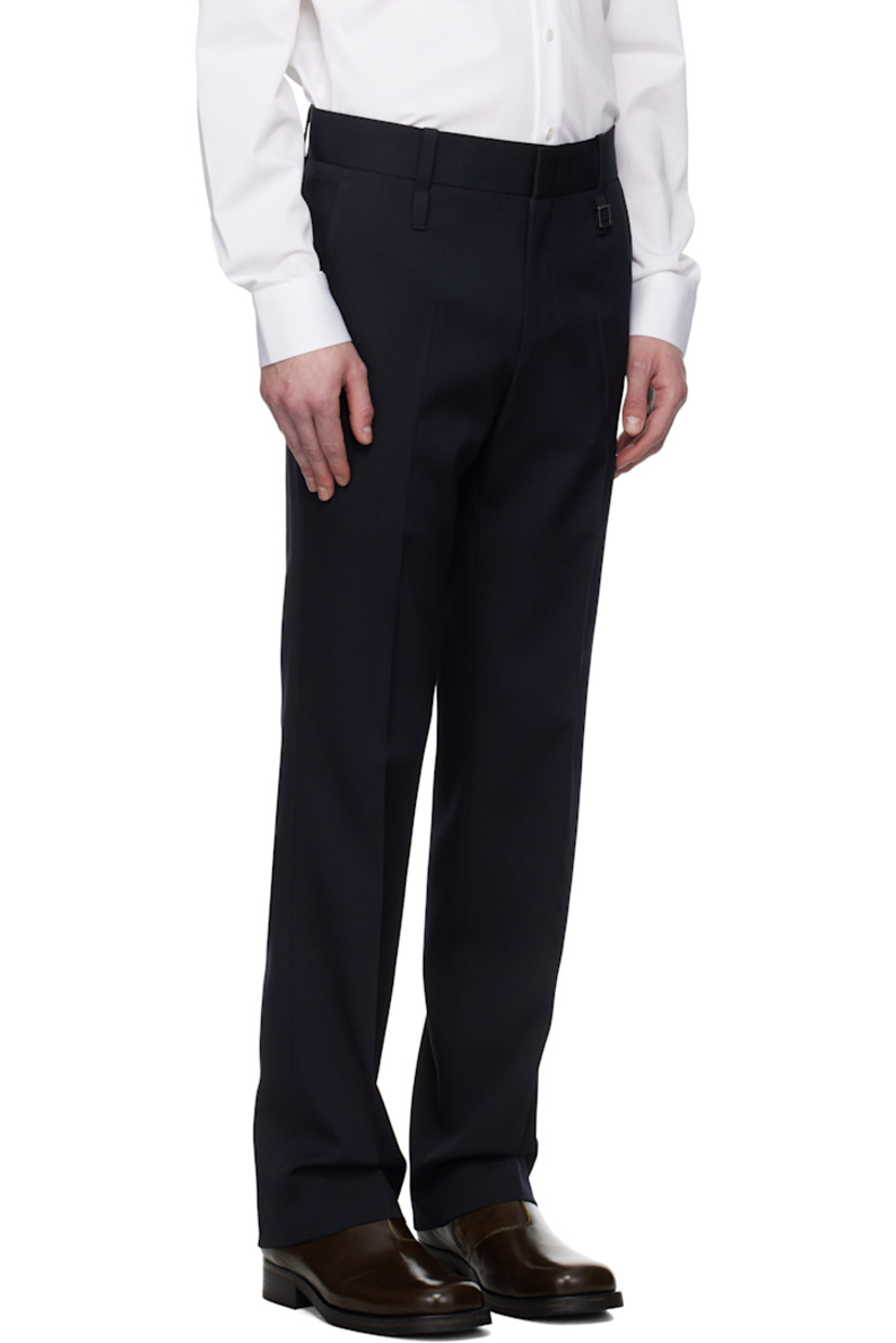 Wool twill trousers.

· Belt loops
· Four-pocket styling
· Zip fly
· Logo hardware at belt loop
· Creased legs

Supplier color: Navy