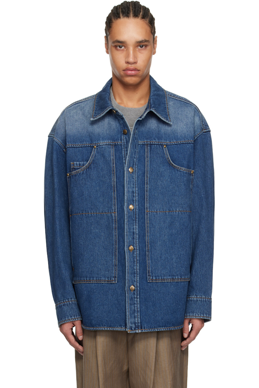 Non-stretch denim shirt. Fading throughout.

· Spread collar
· Button closure
· Patch pockets
· Shirttail hem
· Dropped shoulders
· Buttoned barrel cuffs
· Logo hardware at back collar
· Twin pleats at back yoke
· Logo-engraved antiqued gold-tone hardware
· Contrast stitching in tan

Supplier color: Blue