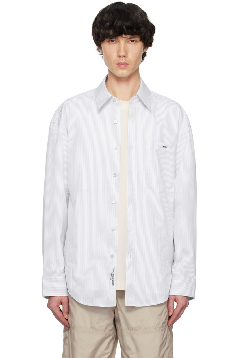 Cotton-blend oxford cloth shirt. Stripes throughout.

· Spread collar
· Button closure
· Logo hardware at patch pocket and back collar
· Button vent at side seams
· Single-button barrel cuffs
· Pleats at back yoke
· Logo printed at back

Supplier color: Blue
