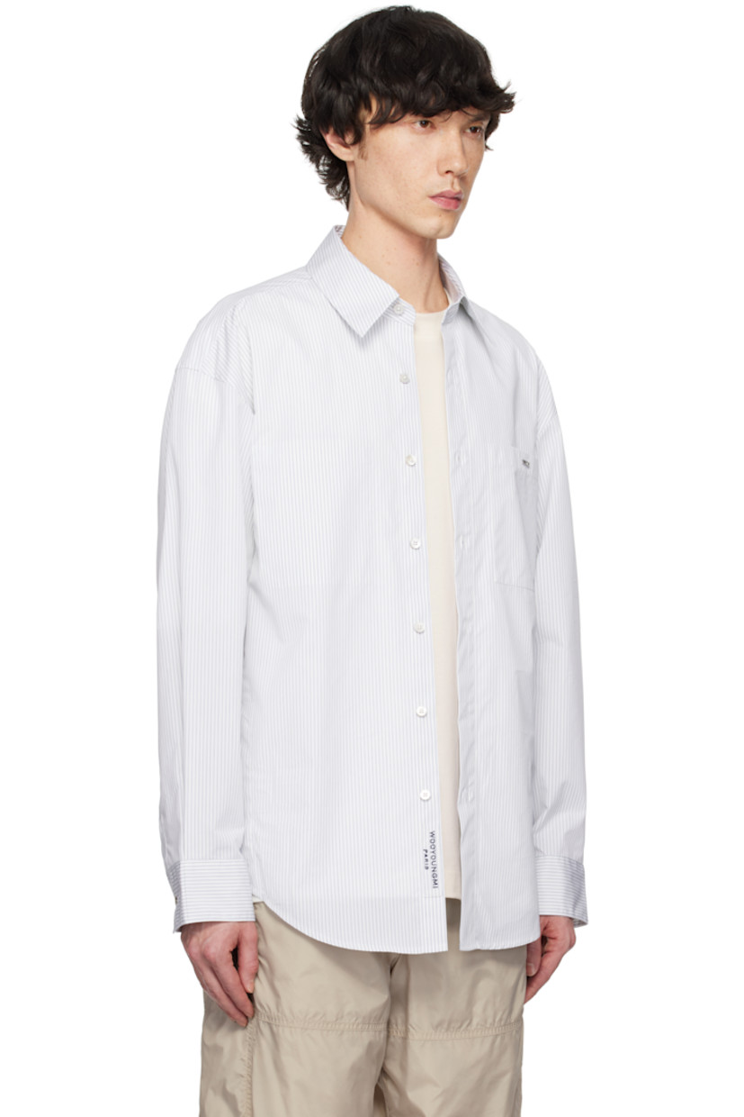 Cotton-blend oxford cloth shirt. Stripes throughout.

· Spread collar
· Button closure
· Logo hardware at patch pocket and back collar
· Button vent at side seams
· Single-button barrel cuffs
· Pleats at back yoke
· Logo printed at back

Supplier color: Blue