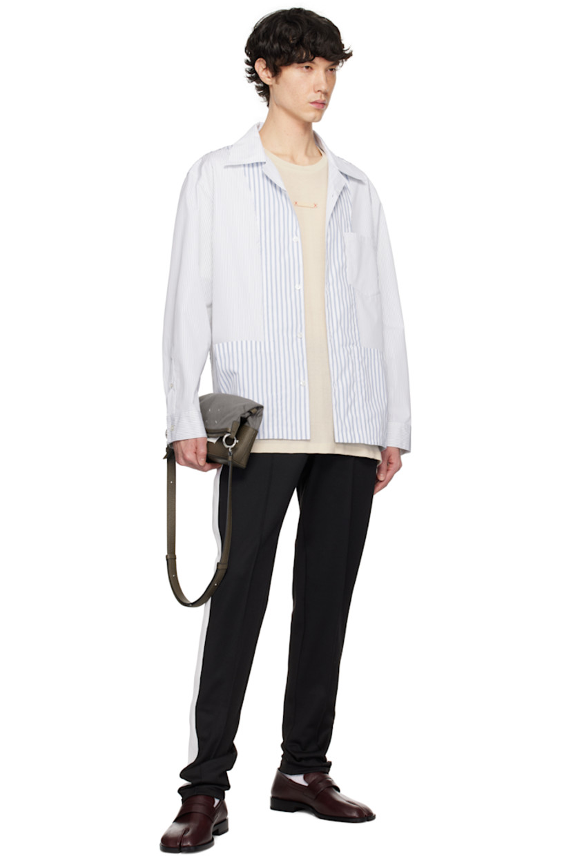 Cotton-blend oxford cloth shirt. Stripes throughout.

· Spread collar
· Button closure
· Logo hardware at patch pocket and back collar
· Button vent at side seams
· Single-button barrel cuffs
· Pleats at back yoke
· Logo printed at back

Supplier color: Blue