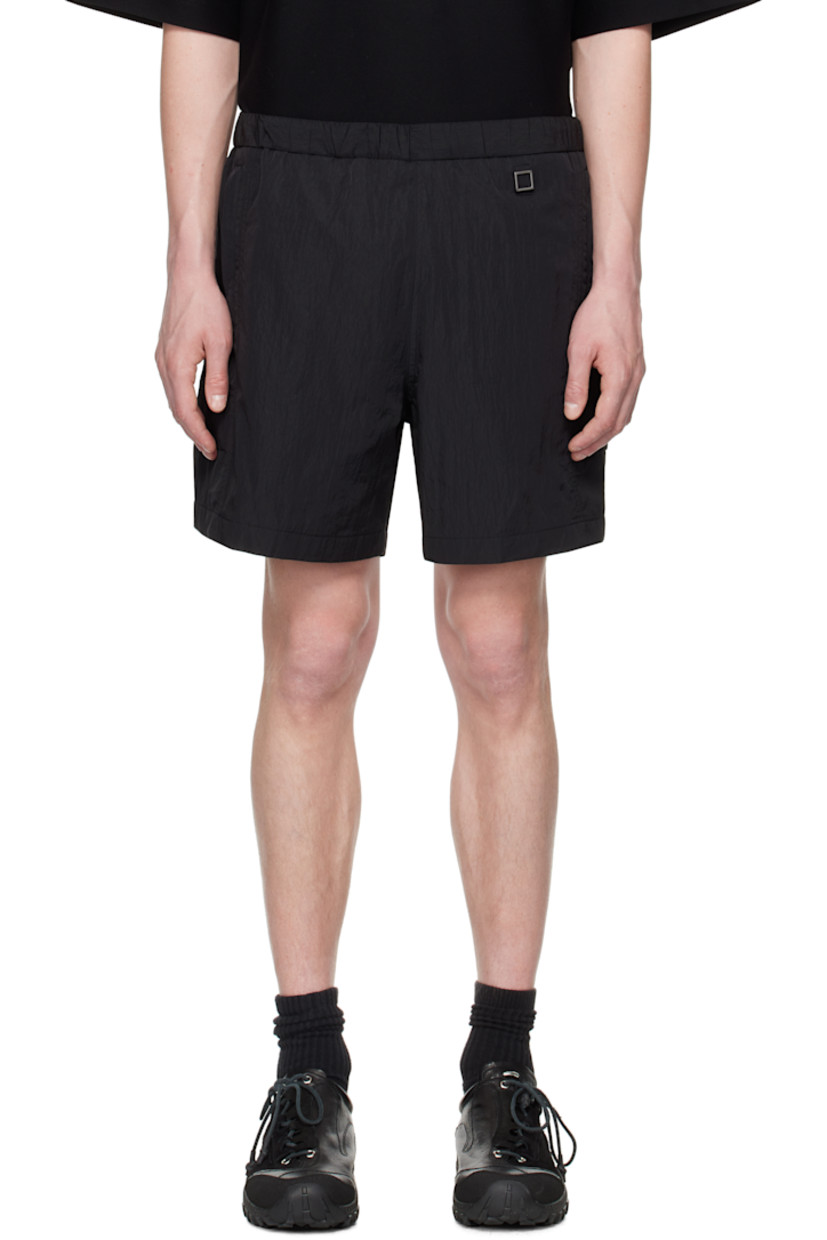 Crinkled nylon taffeta shorts. 

· Concealed bungee-style drawstring at elasticized waistband
· Three-pocket styling
· Logo hardware at waist and leg
· Flap pocket at outseams
· Logo flag at back waistband
· Full mesh lining

Supplier color: Black