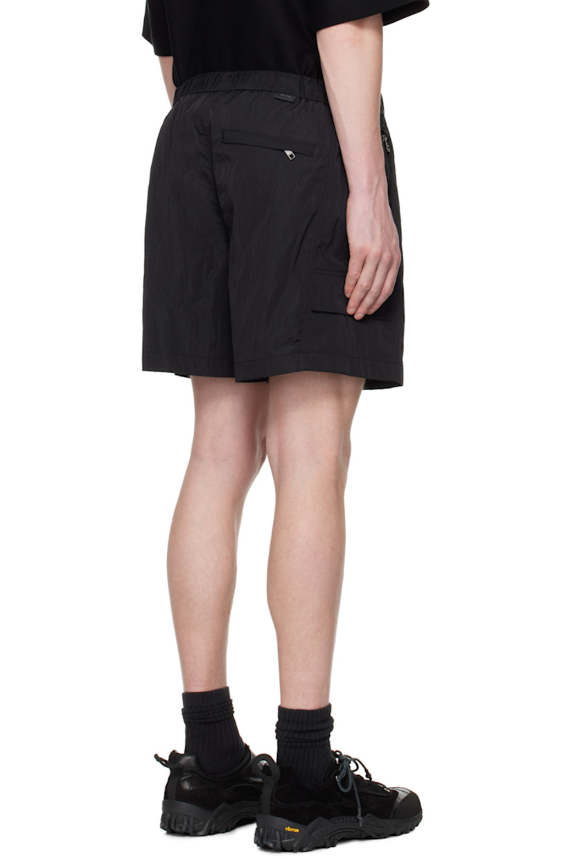 Crinkled nylon taffeta shorts. 

· Concealed bungee-style drawstring at elasticized waistband
· Three-pocket styling
· Logo hardware at waist and leg
· Flap pocket at outseams
· Logo flag at back waistband
· Full mesh lining

Supplier color: Black