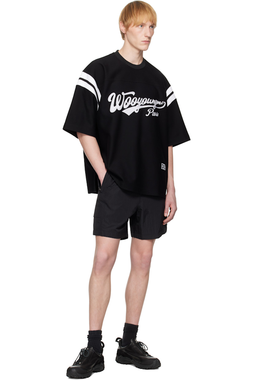 Crinkled nylon taffeta shorts. 

· Concealed bungee-style drawstring at elasticized waistband
· Three-pocket styling
· Logo hardware at waist and leg
· Flap pocket at outseams
· Logo flag at back waistband
· Full mesh lining

Supplier color: Black
