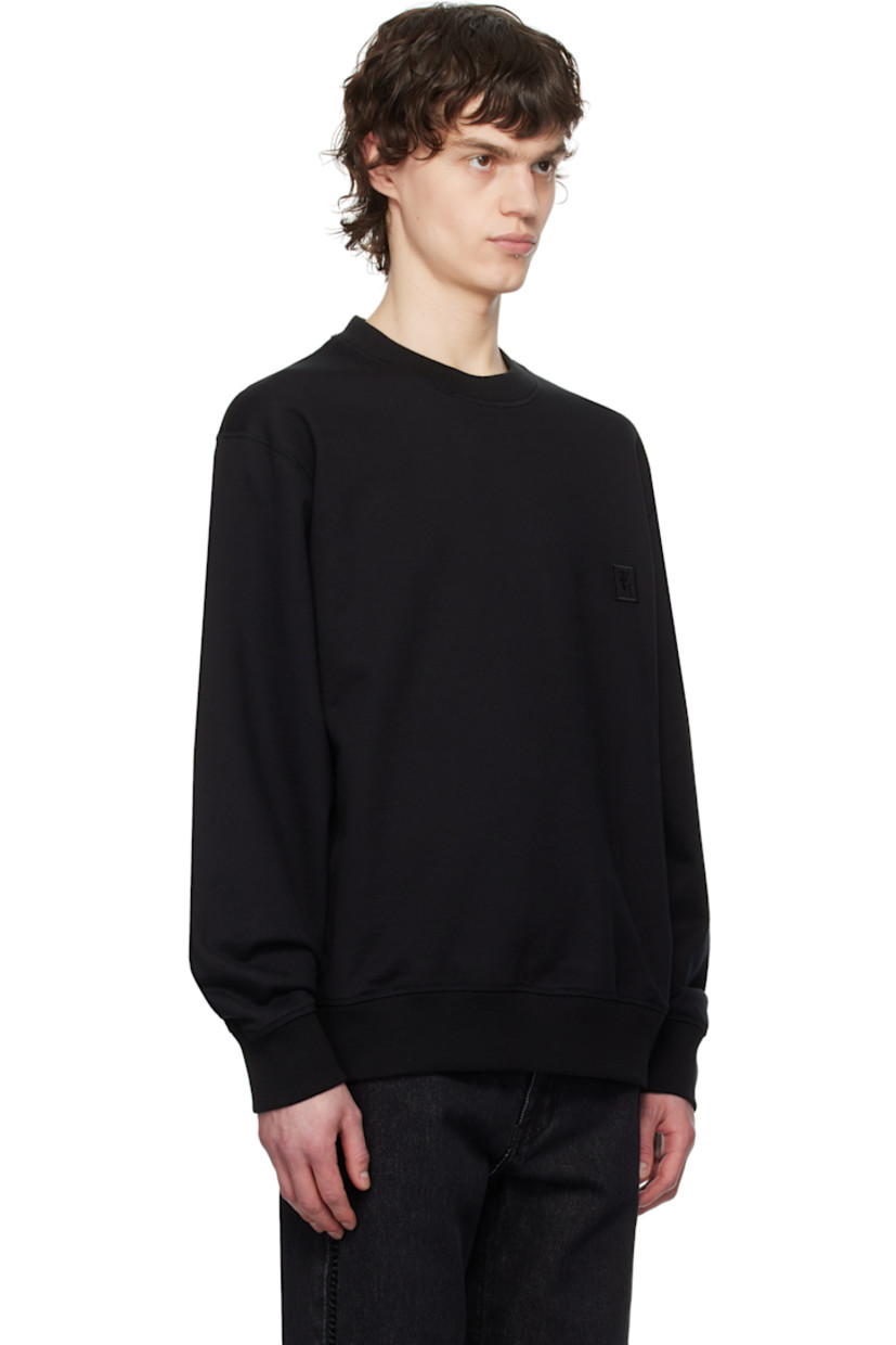 French terry sweatshirt.

· Rib-knit crewneck, hem, and cuffs
· Embroidered logo patch at chest
· Logo hardware at back collar
· Logo, graphic, and text printed at back

Supplier color: Black
