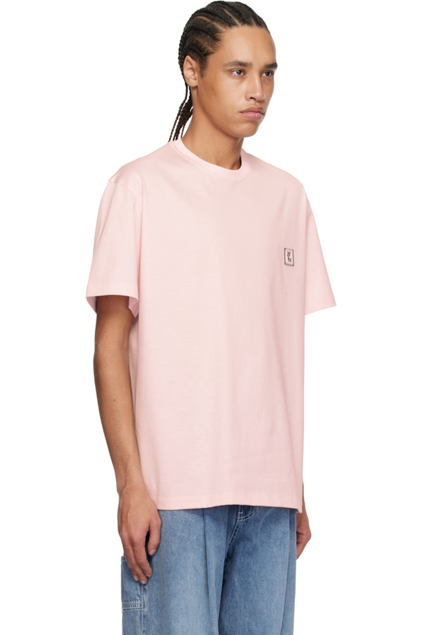 Cotton jersey T-shirt.

· Rib-knit crewneck
· Embroidered logo patch at chest
· Vented side seams
· Logo hardware at back collar
· Logo printed at back

Supplier color: Pink