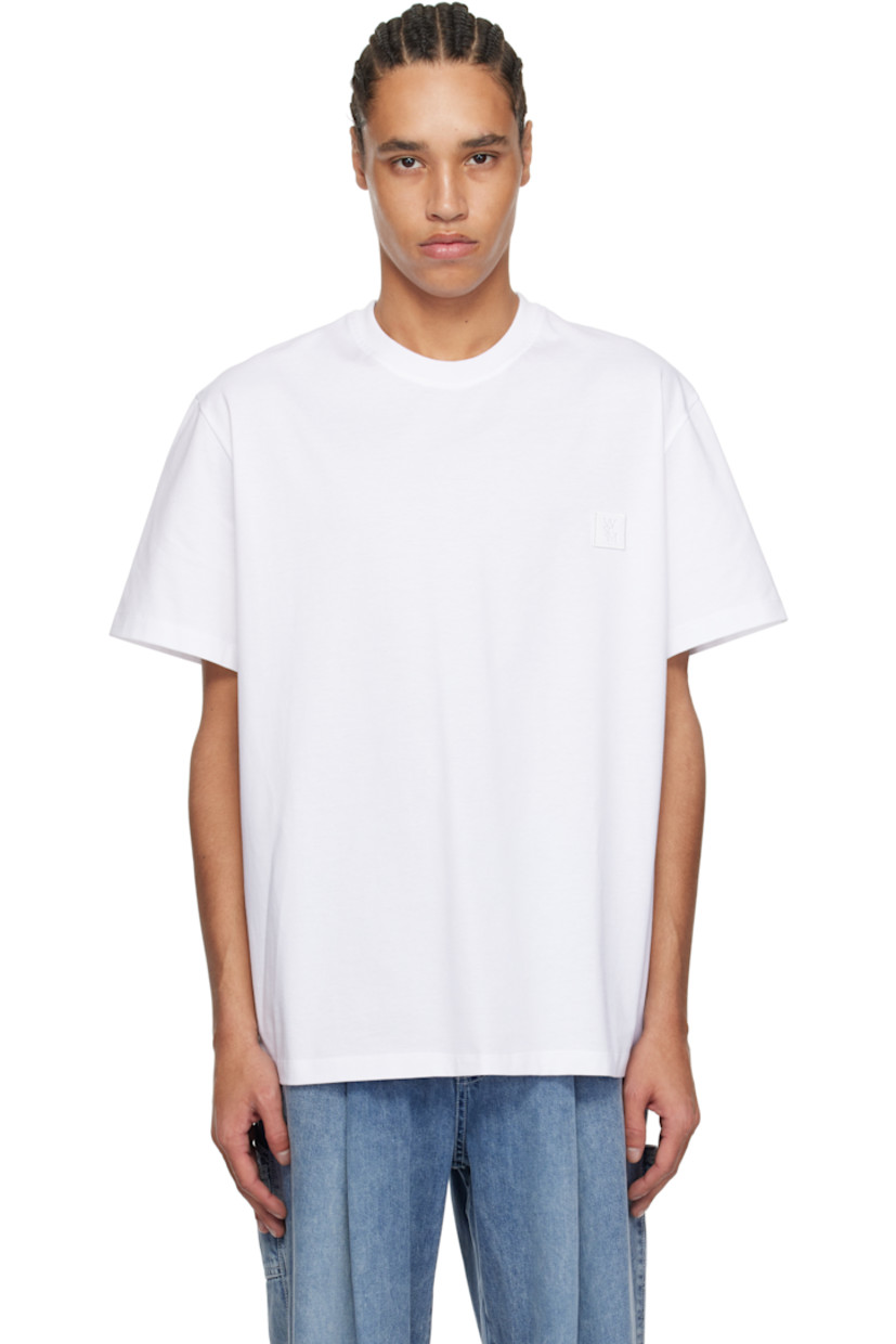 Cotton jersey T-shirt.

· Rib-knit crewneck
· Embroidered logo patch at chest
· Vented side seams
· Logo hardware at back collar
· Logo and graphic printed at back

Supplier color: White