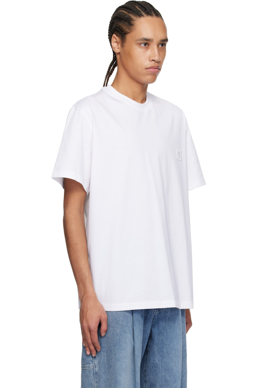 Cotton jersey T-shirt.

· Rib-knit crewneck
· Embroidered logo patch at chest
· Vented side seams
· Logo hardware at back collar
· Logo and graphic printed at back

Supplier color: White