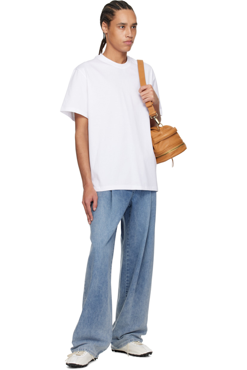 Cotton jersey T-shirt.

· Rib-knit crewneck
· Embroidered logo patch at chest
· Vented side seams
· Logo hardware at back collar
· Logo and graphic printed at back

Supplier color: White