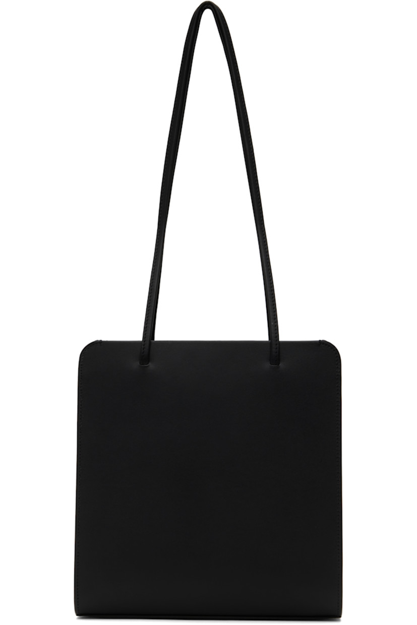 Double-tanned and waxed calfskin shoulder bag in black. 

· Twin fixed shoulder straps
· Patch pocket at back face 
· Magnetic closure
· Patch pocket at interior 
· Twill lining
· H9.5" x W9" x D3" 

Supplier color: Noir