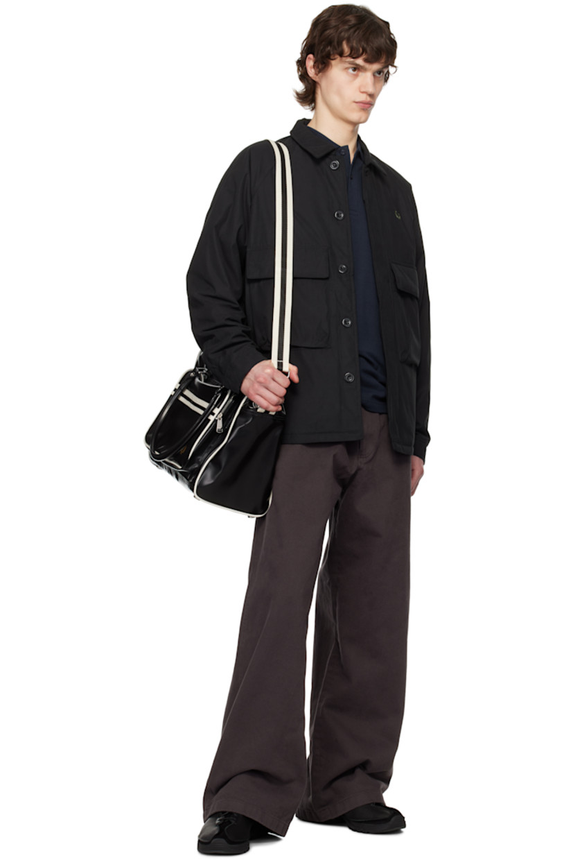 Padded recycled polyester- and cotton-blend twill jacket. 

· Spread collar
· Concealed button closure
· Logo embroidered at chest
· Flap pockets
· Raglan sleeves
· Press-stud fastening at cuffs 
· Full quilted satin interior

Supplier color: Black