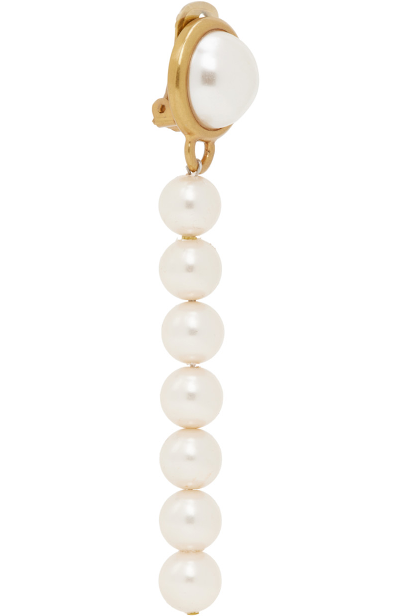 Single drop earring in antiqued gold-tone brass.

· Faux-pearl at face
· Beaded faux-pearls at drop
· Clip-on fastening
· H4" x W0.75"

Supplier color: Multi/Ivory