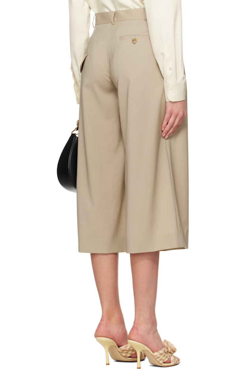 Virgin wool broadcloth trousers. 

· Belt loops
· Four-pocket styling
· Zip fly
· Inverted box pleats at front 
· Cropped legs
· Darts at back waist
· Partially lined
· Horn hardware

Supplier color: Beige