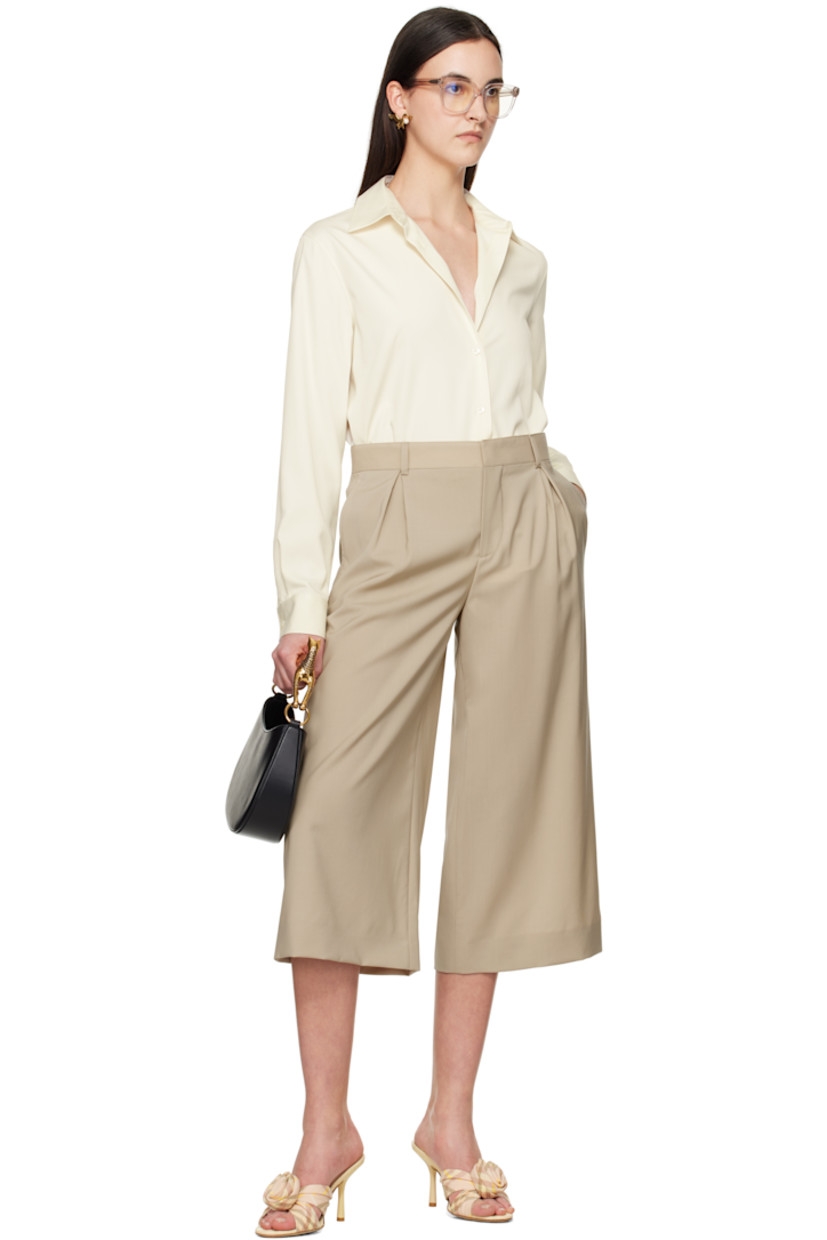 Virgin wool broadcloth trousers. 

· Belt loops
· Four-pocket styling
· Zip fly
· Inverted box pleats at front 
· Cropped legs
· Darts at back waist
· Partially lined
· Horn hardware

Supplier color: Beige