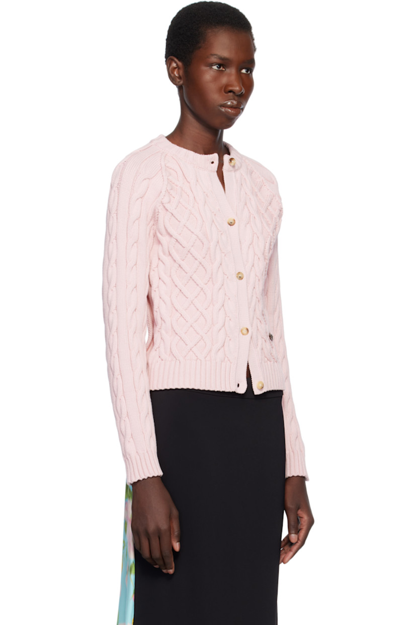 Cable-knit organic cotton-blend cardigan.

· Rib-knit crewneck, hem, and cuffs
· Button closure
· Leather logo patch at front
· Raglan sleeves
· Cutout at back

Supplier color: Pale pink