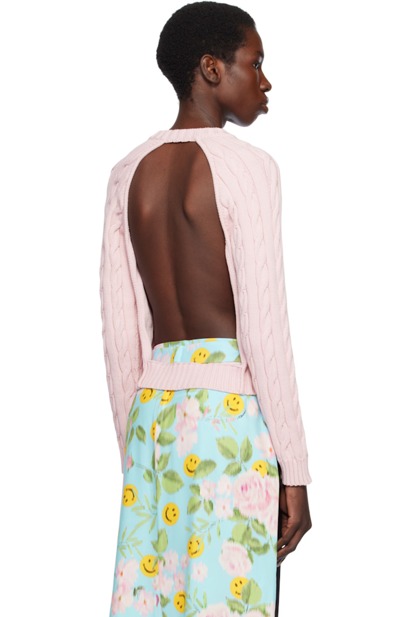 Cable-knit organic cotton-blend cardigan.

· Rib-knit crewneck, hem, and cuffs
· Button closure
· Leather logo patch at front
· Raglan sleeves
· Cutout at back

Supplier color: Pale pink