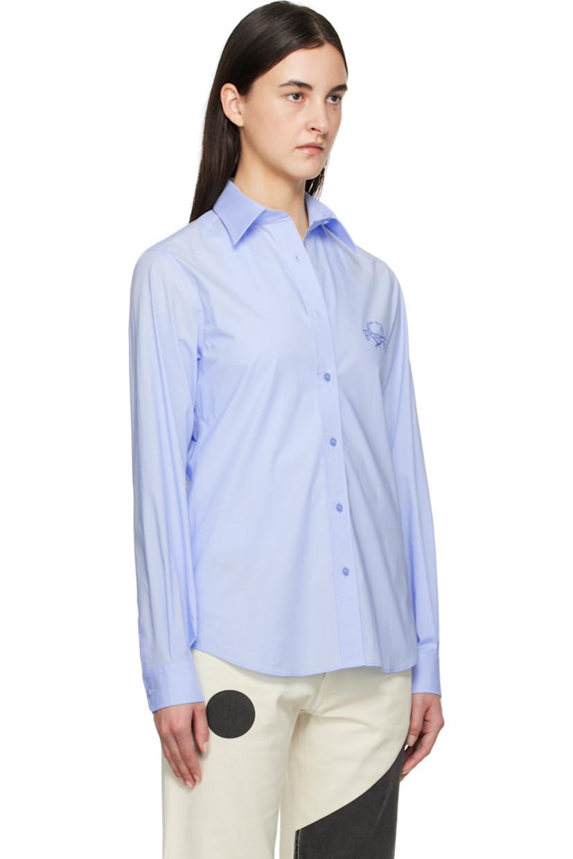 Stretch cotton poplin shirt.

· Spread collar
· Button closure
· Logo graphic embroidered at chest
· Shirttail hem
· Pleats at single-button barrel cuffs

Supplier color: Multi light blue