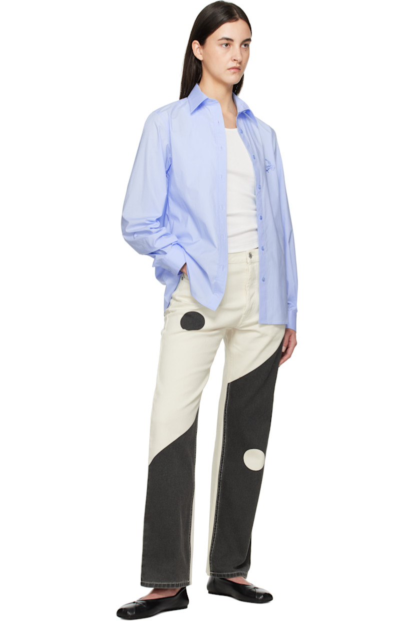 Stretch cotton poplin shirt.

· Spread collar
· Button closure
· Logo graphic embroidered at chest
· Shirttail hem
· Pleats at single-button barrel cuffs

Supplier color: Multi light blue