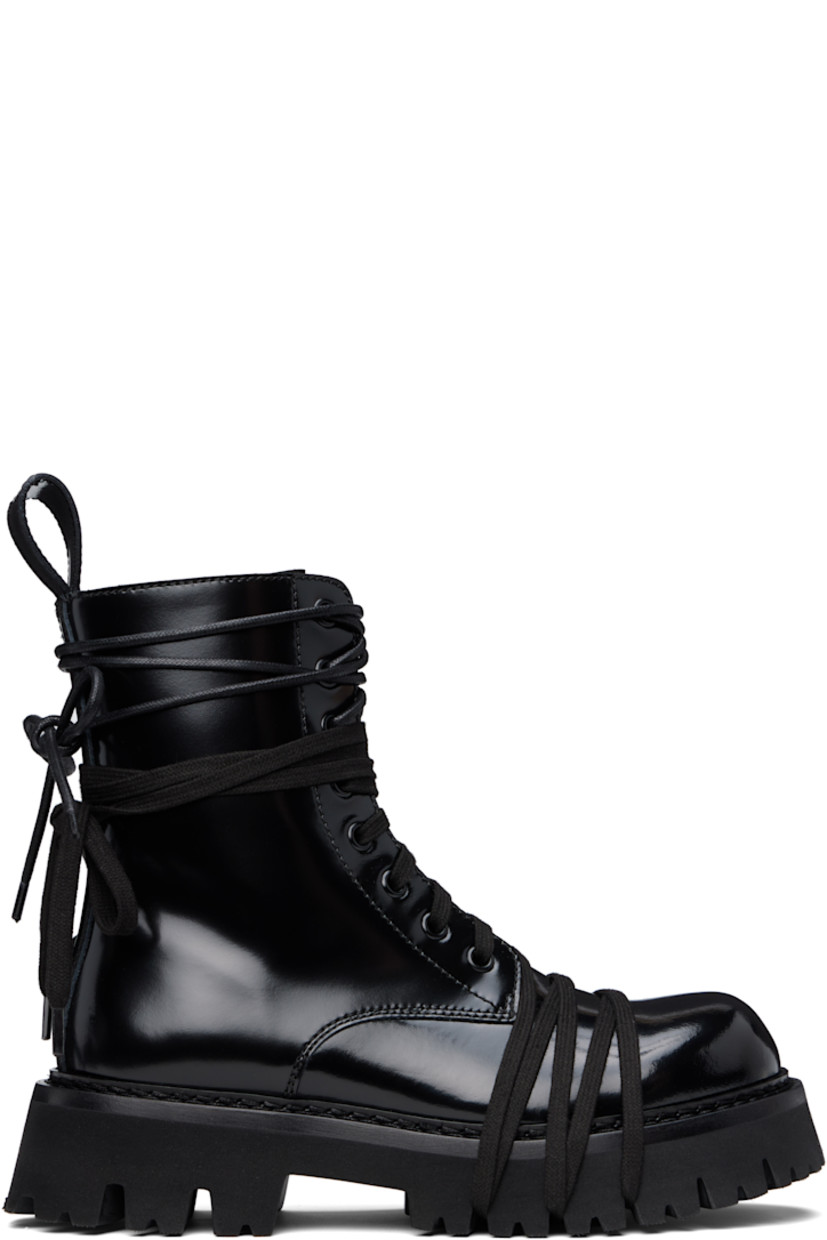 Ankle-high polished calfskin boots in black.

· Wraparound lace-up detailing at vamp and collar
· Lace-up closure
· Pull-loop at heel collar
· Topstitching at welt
· Treaded foam rubber sole

Supplier color: Black