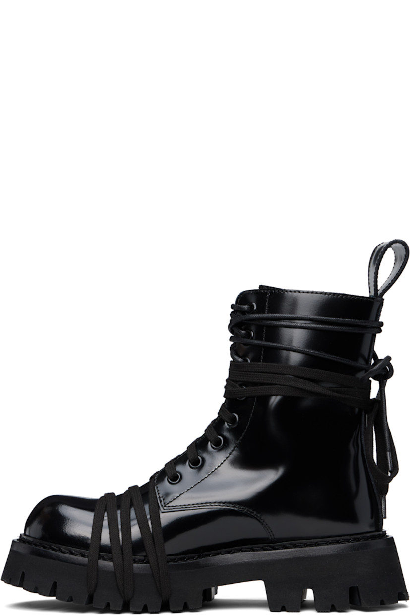 Ankle-high polished calfskin boots in black.

· Wraparound lace-up detailing at vamp and collar
· Lace-up closure
· Pull-loop at heel collar
· Topstitching at welt
· Treaded foam rubber sole

Supplier color: Black