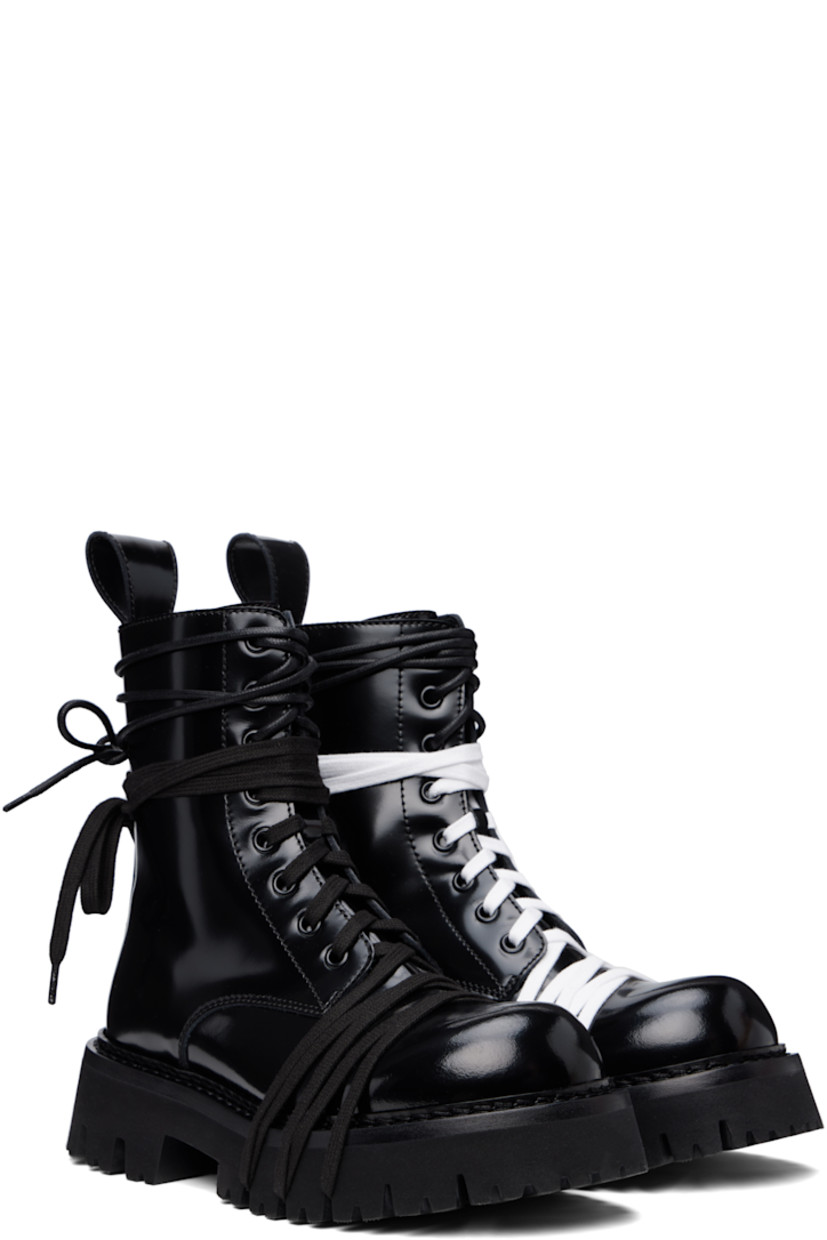 Ankle-high polished calfskin boots in black.

· Wraparound lace-up detailing at vamp and collar
· Lace-up closure
· Pull-loop at heel collar
· Topstitching at welt
· Treaded foam rubber sole

Supplier color: Black