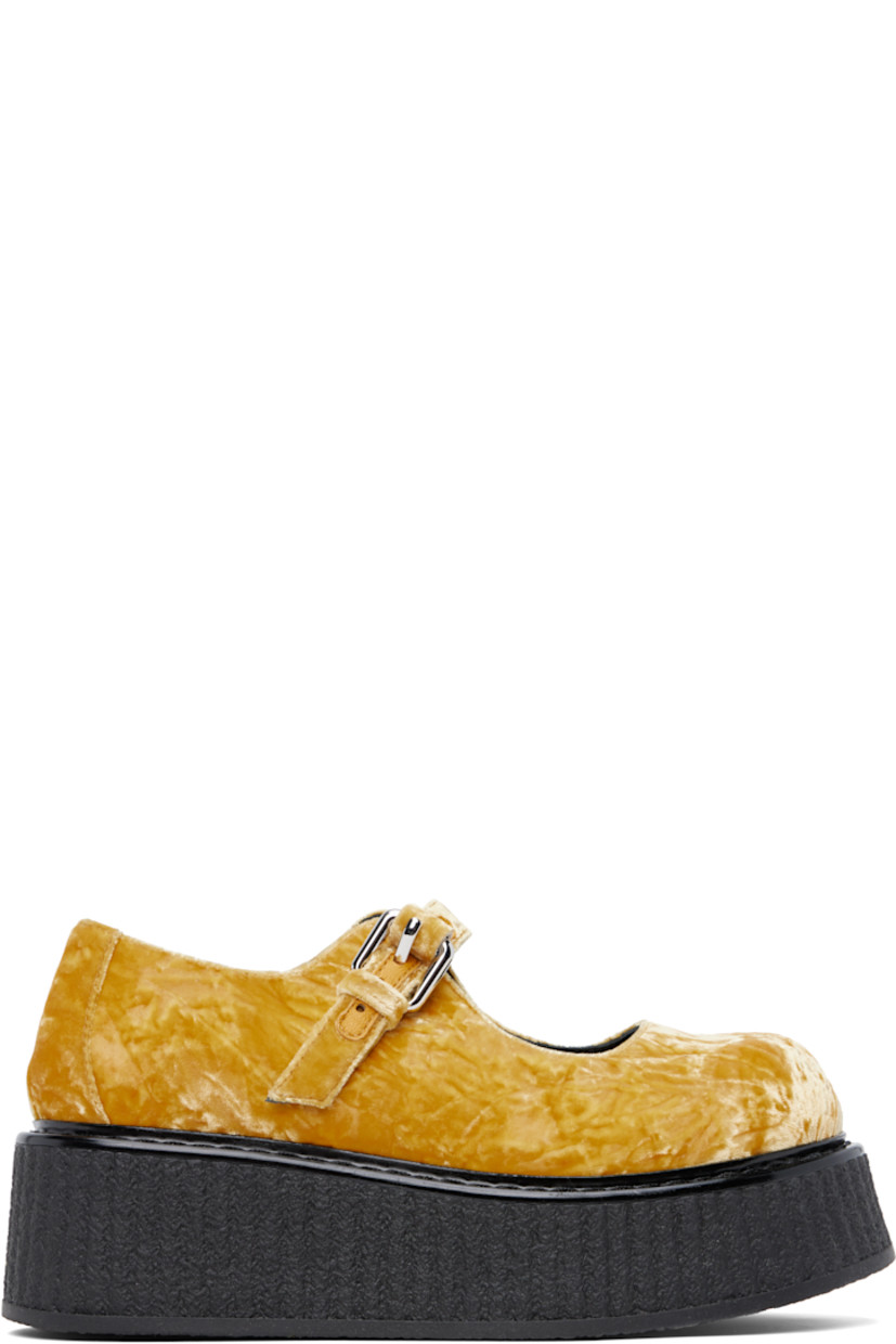 Crushed velvet Mary Jane-style loafers in yellow.

· Pin-buckle strap at vamp
· Buffed leather lining
· Crêpe-rubber platform sole
· Platform: H2"

Supplier color: Ochre