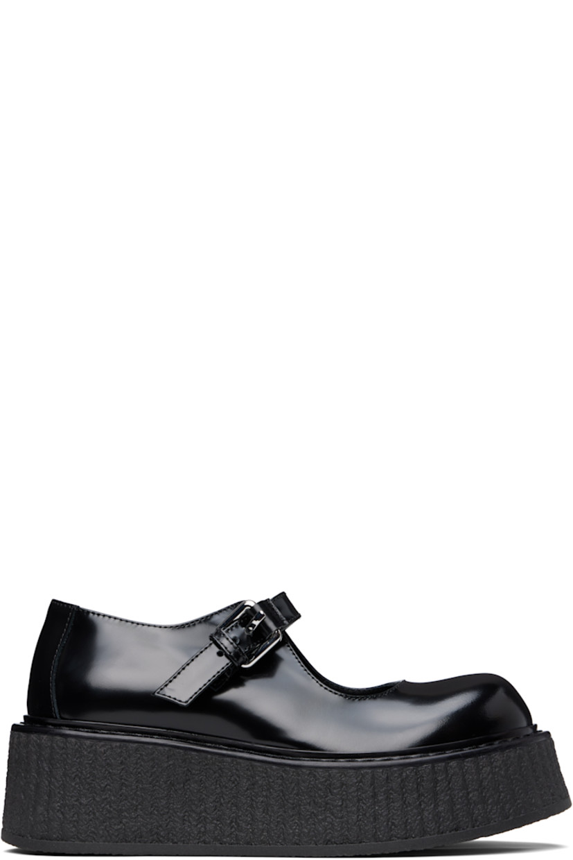Buffed leather Mary Jane-style loafers in black.

· Pin-buckle strap at vamp
· Crêpe-rubber platform sole
· Platform: H2"

Supplier color: Black