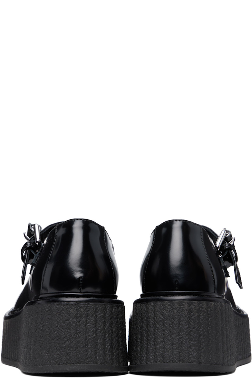 Buffed leather Mary Jane-style loafers in black.

· Pin-buckle strap at vamp
· Crêpe-rubber platform sole
· Platform: H2"

Supplier color: Black